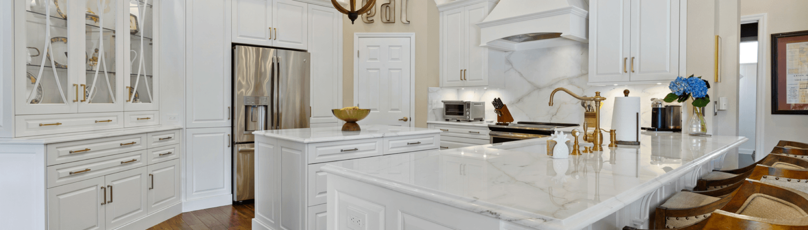 Luxury white kitchen with gold decorative hardware