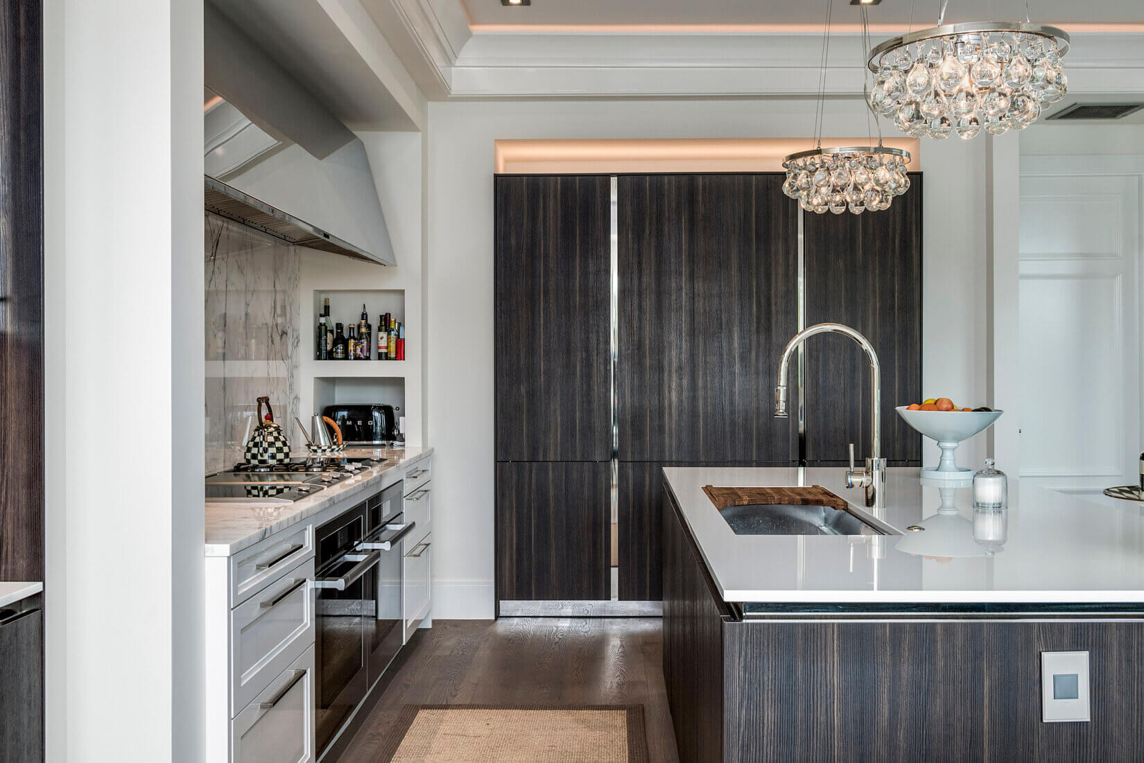Luxury kitchen with dark-wood cabinetry and upscale appliances