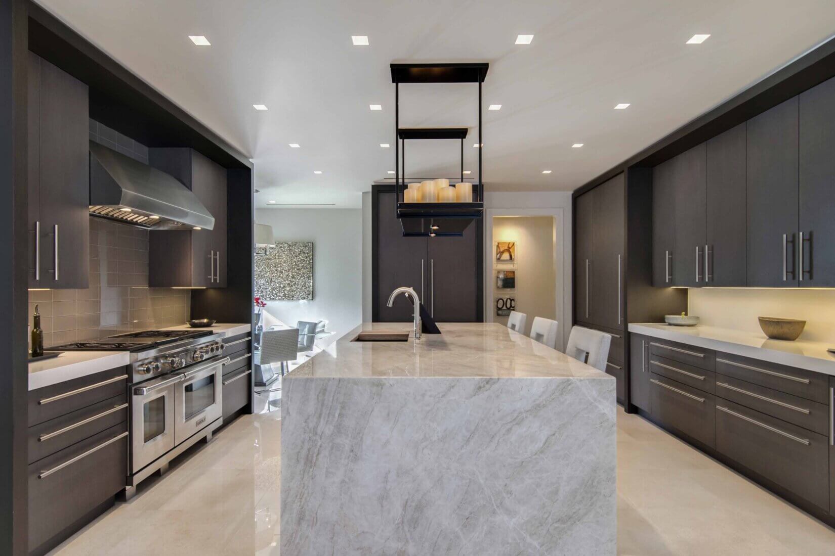 Luxury kitchen and dining area with dark-wood cabinetry