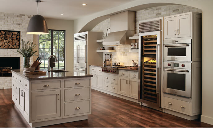 Cozy luxury kitchen with high-end appliances, island and wine fridge