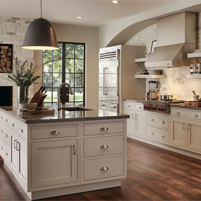 Kitchen island in homey luxury kitchen with granite countertop and sink